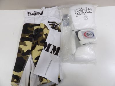 a pair of camouflage pants and a roll of toilet paper on a table
