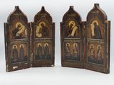 three wooden panels with icons of saints and angels