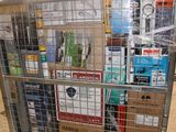 a metal cart with many boxes on top of it