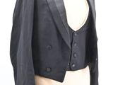 a mannequin torso with a black jacket on it