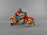 a figurine of a man riding a motorcycle