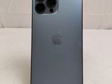 a close up of the back of an iphone 11 with a camera attached