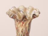 a glass vase that is sitting on a table