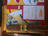 two boxes of cigars sitting next to each other on a table