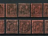a group of stamps with different designs on them on a black surface