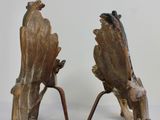 two pieces of wood that are sitting on a table