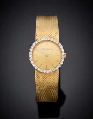 an 18k gold and diamond set wristwatch