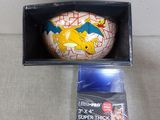 a small box with a toy in it on a table