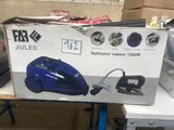 a box with a vacuum on a table in a room