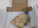 a cardboard box with a bag of food inside of it