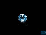 a close up of a blue diamond on a black background