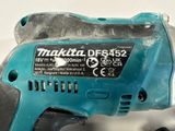 a cordless drill that is sitting on a table