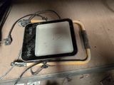 a cell phone sitting on top of a piece of metal