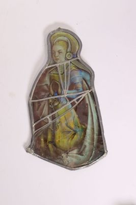 a picture of a religious figurine hanging on a wall