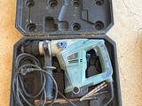 a tool in a case that is sitting on the floor