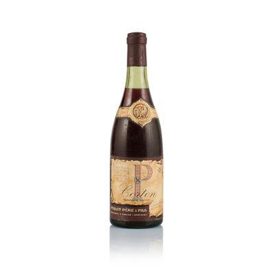 a bottle of wine sitting on top of a white surface