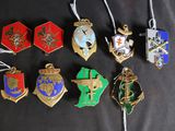 a lot of badges that are on a black shirt