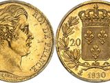 a gold sovereign coin with a crown on top of it