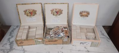 three boxes that are sitting on a marble table