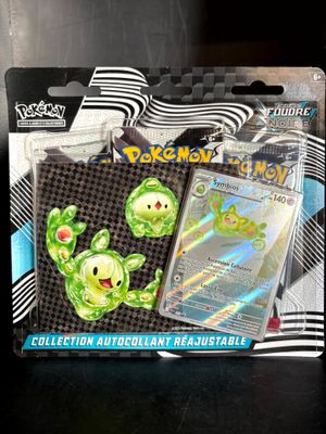 a pokemon trading card and a card holder in the package