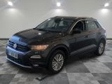 a black volkswagen suv parked on a checkered floor in a garage