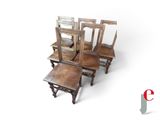 four chairs and a table with a small table on top of it