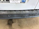 a close up of the bumper of a car with a sticker on it