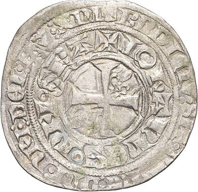an old silver coin with an image of a man on it