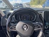 the interior of a car with a steering wheel and dashboard controls