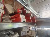 a lot of boxes on a shelf in a room