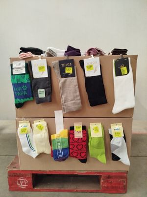 several pairs of men ' s socks are on display on a pallet