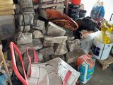 a large pile of items that are sitting in a garage