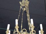 a chandelier hanging from the ceiling of a restaurant