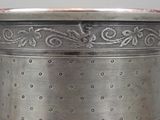 a silver container that is sitting on a table