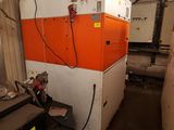 an orange and white machine that is in a building
