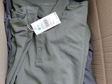 a box with a shirt in it that has a tag on it