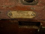 a close up of a metal plate on a wooden box