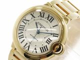 an image of a gold wrist watch with roman numerals on it