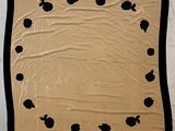 an image of a blanket with black flowers on it