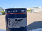 a can of paint sitting on top of a table