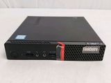a close up of a small black computer on a white surface