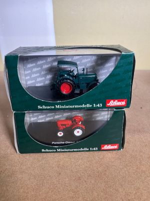 the box is open on the table with a toy tractor in it