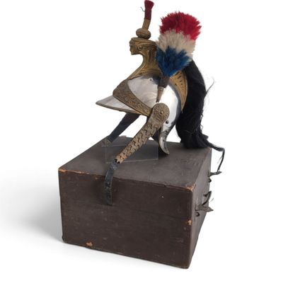 a stuffed animal that is sitting on top of a box