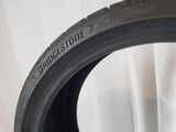 a close up of a tire on a white surface