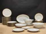 a lot of plates and bowls on the table