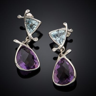 a pair of amethorate and aquamarinee earrings