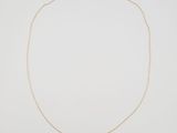 a gold chain necklace with a heart pendant on a white background