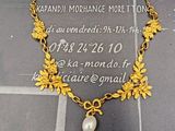 collier plaqué or orné d'une perle au centre
