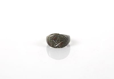 an image of a ring with a clock on it on a white surface
