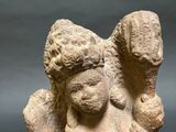 statue of a woman holding a child in her arms